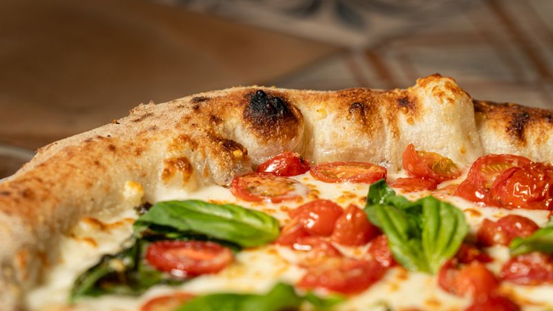 Seasonal fresh Margherita marco pizza with herbs