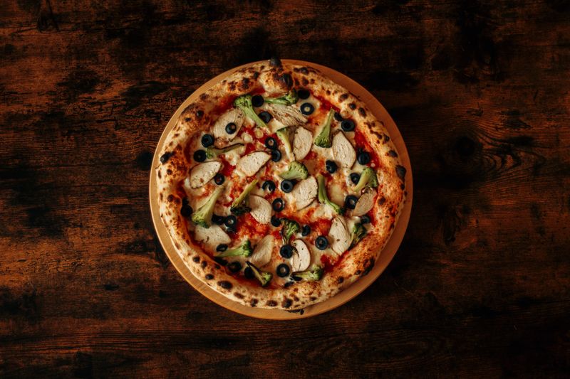 BBQ chicken marco pizza with caramelised onions